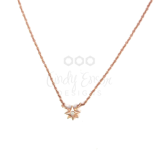 Tiny 8 Point Star Necklace with Diamond Center