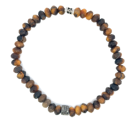A bracelet made of tiger's eye beads with a diamond accent, featuring a silver-tone clasp.