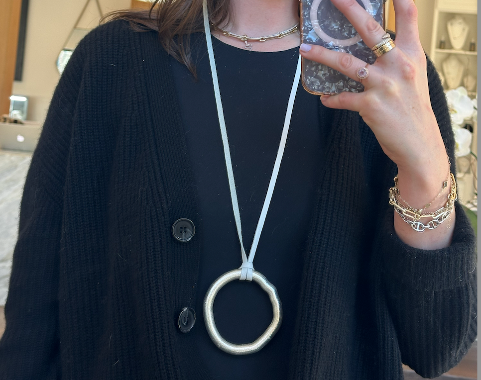 Unoxidized Sterling Organic Circle Necklace on White Leather