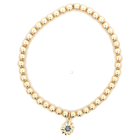 Gold Filled Bead Bracelet with Blue Crystal Swirl Charm