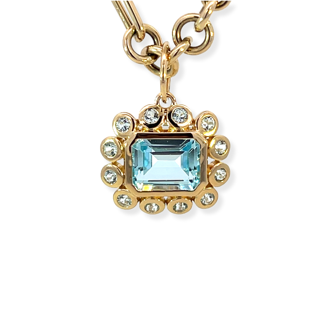 East West Emerald Cut Blue Topaz Pendant with Bezeled Blue Topaz Halo