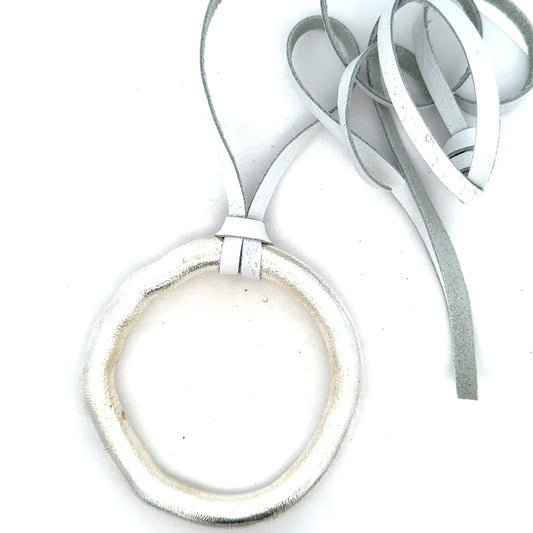 Unoxidized Sterling Organic Circle Necklace on White Leather